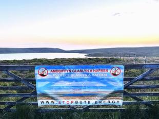 Anti-wind farm banner 'stolen' from gate for fifth time