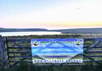 Anti-wind farm banner 'stolen' from gate for fifth time