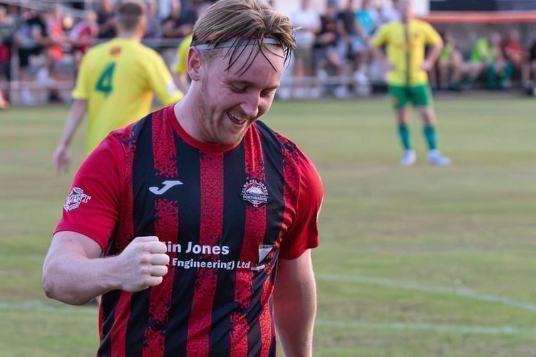 Rhys Alun celebrates after scoring Porthmadog's second goal