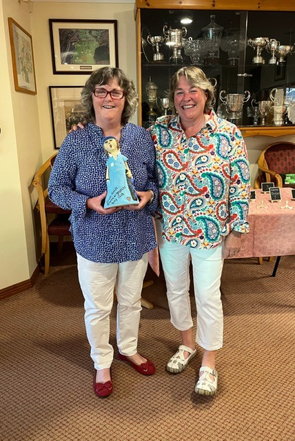 Anne Morris receiving her prize from captain Helen Lewis