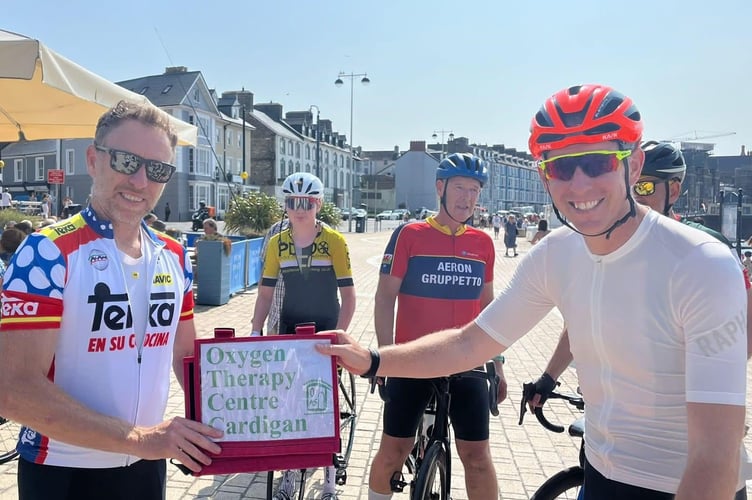 Michael Tarling Shelley Childs Cyclists handover Aberystwyth