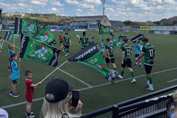 Aberystwyth Town make their way out onto the Park Avenue pitch