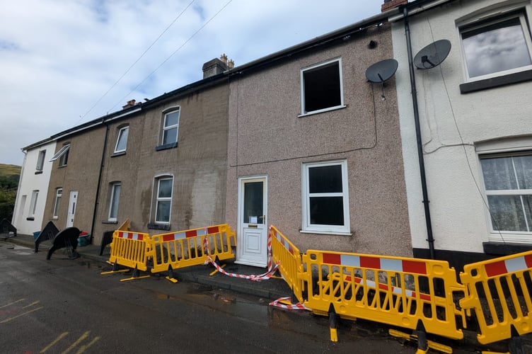 Cordons remain around the affected houses. Photo: Cambrian News