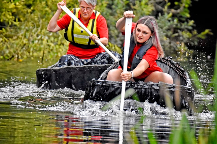 Handlers battle it out in the 100 yard ladies Teifi coracle race