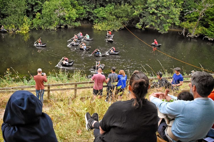 Crowds watched the event from the river bank