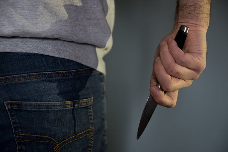 File photo dated 16/01/20 of a model posing while holding a knife. Robberies involving a knife, or the threat of one, have reduced in most of the UK's high-risk areas, according to Home Office data. Home Secretary Yvette Cooper said the 6% overall annual reduction in knife-enabled robbery incidents is a direct result of targeted police action. Issue date: Friday August 1, 2025.