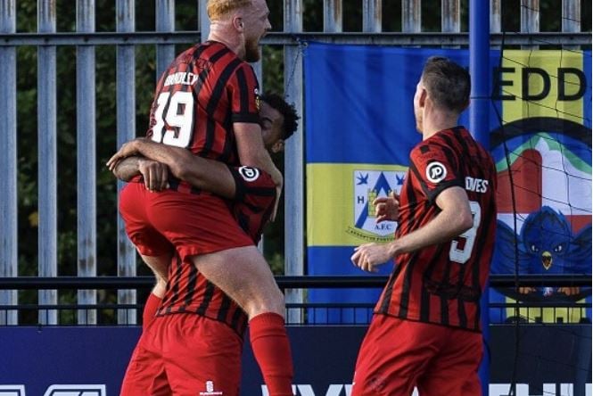 Celebrations after Dominic Smith headed in Sion Bradley's corner