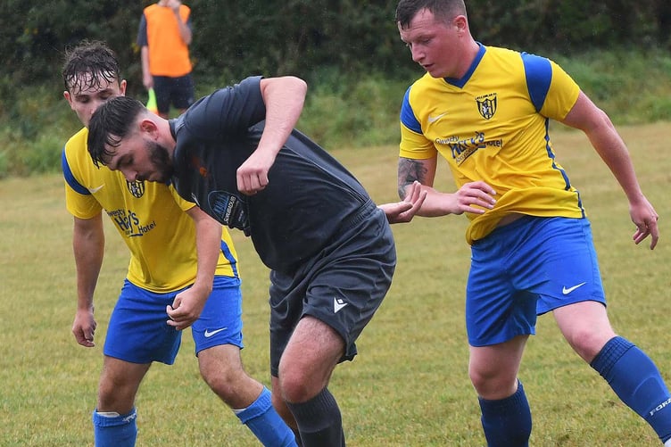 Tywyn's Kian Cunliffe protects the ball (Photo: Doris O'Keefe)