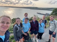 Veterinarians walk coastal path to mark practice’s 90th anniversary