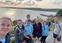 Veterinarians walk coastal path to mark practice’s 90th anniversary