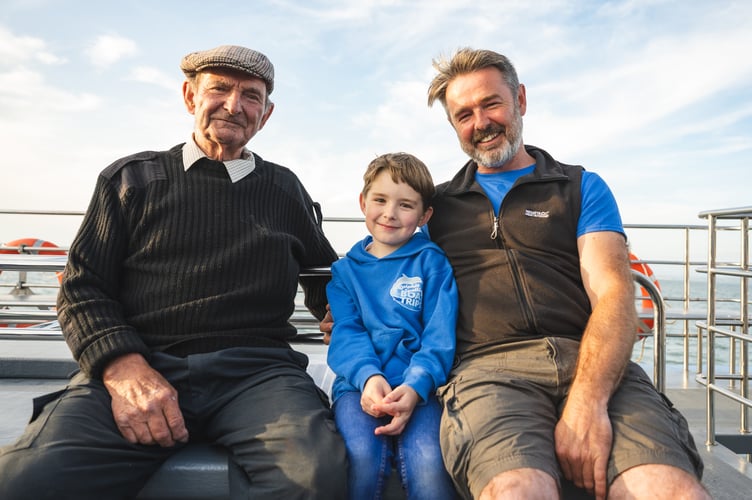 Three generations of the Evans family, Winston, Jonathan and Oliver, seven.