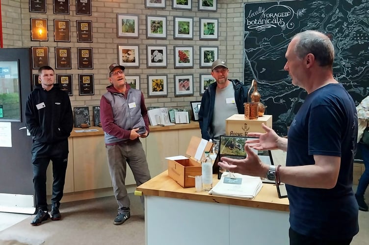 Accommodation providers listening to Danny Cameron, co-owner of Corris Caverns and Dyfi Distillery, during a familiarisation visit this summer.