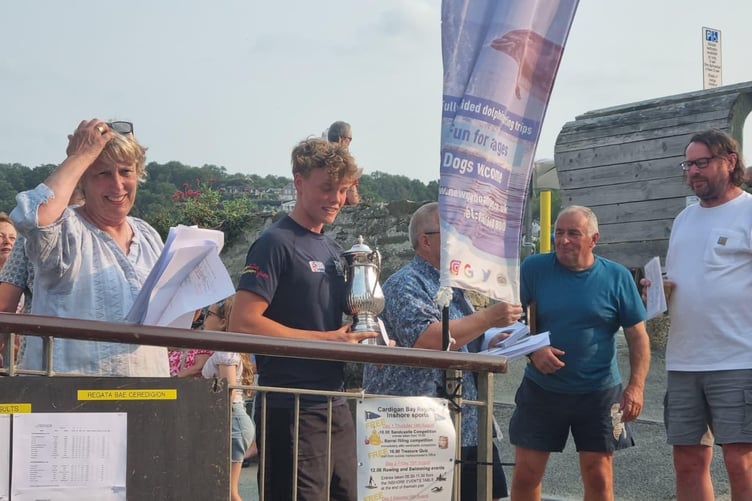 Henry Powell, Martin Wood and Iain Wilson collecting silverware