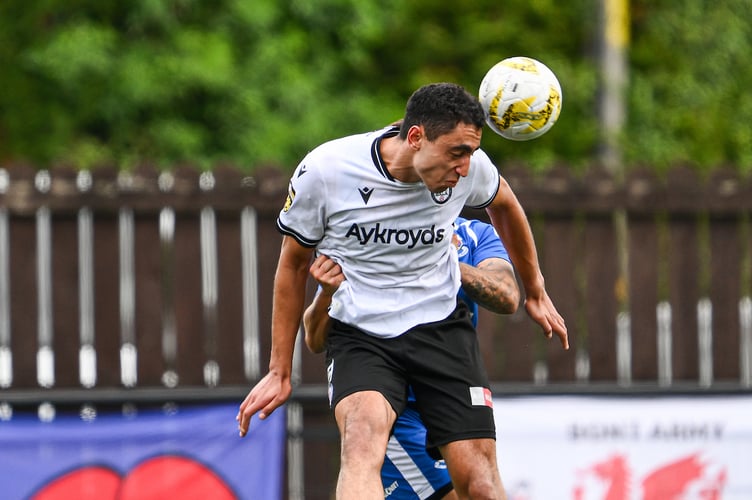 BALA, WALES - 06 SEPTEMBER 2025: Hussein Mehasseb of Bala Town jumps up to win the high ball during the JD Cymru Premier between Bala Town and Penybont at the Maes Tegid in Bala on the 6th September 2025. (Pic by Craig Thomas/FAW)