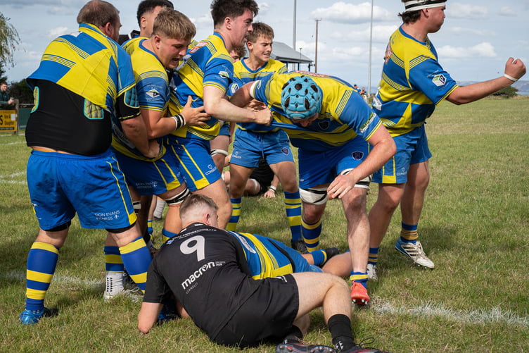 Celebrations as Owain Bonsall crosses the line