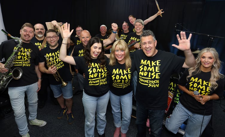 The Make Some Noise band. Front Rhys Meirion and daughter Elan with Head of Service Heather Powell.