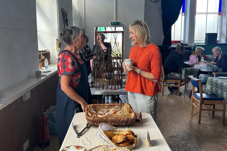 Nerys Howell (right) speaking to a vendor at Borth Farmers' Market. Photo: Nerys Howell (right) speaking to a vendor at Marchnad Ffermwyr Borth Farmers' Market