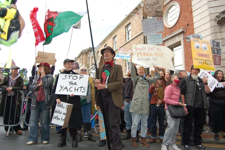 The counter protest calling to 'stop the yachts' rather than 'stop the boats'. Photo: Cambrian News