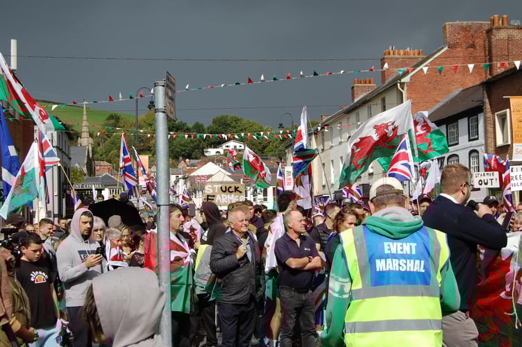 The anti-immigration crowd listening to Reform Councillor Karl Lewis. Photo: Cambrian News