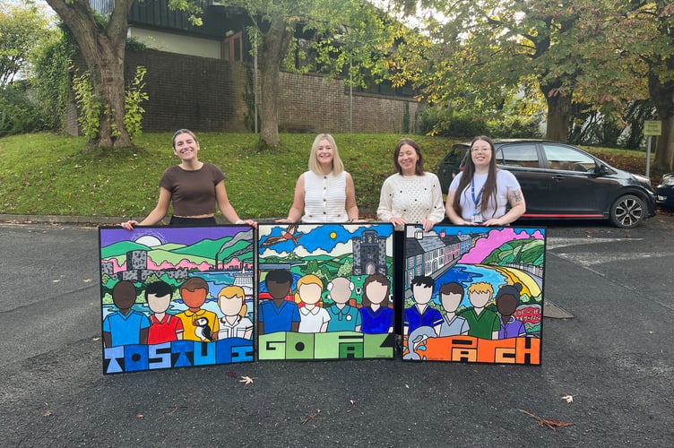 Hywel Dda staff with some of the new artworks
