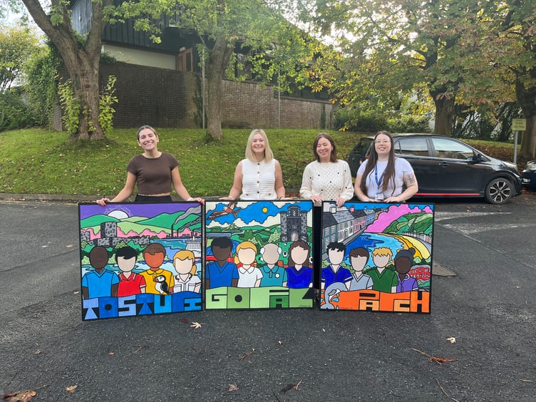 Hywel Dda staff with some of the new artworks