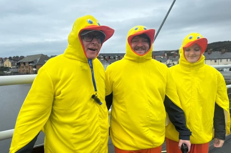 Duck supporters Richard Griffiths (Club Executive Secretary) Scott Friel (Club Vice-President) and volunteer Elan Mabbutt