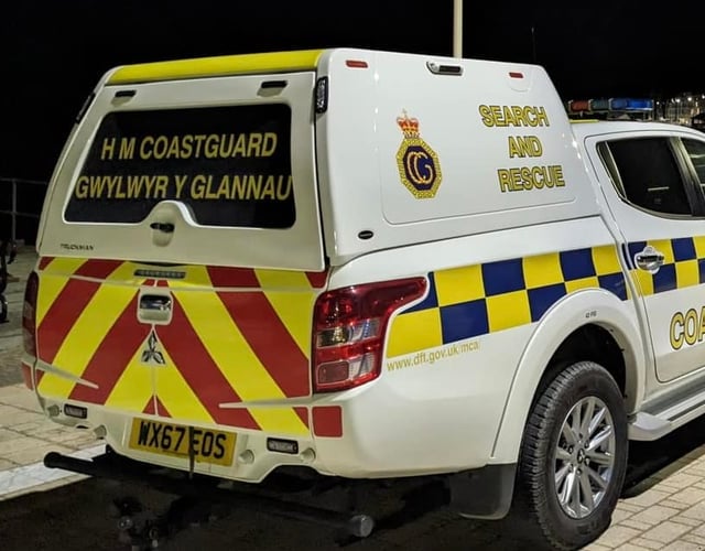 Dog walker rescued by coastguard