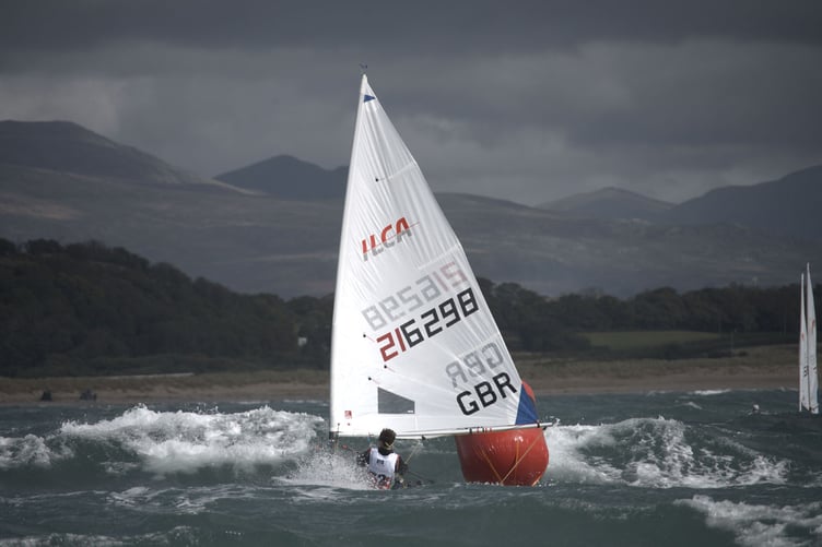 Steffan sailing at the RYA Welsh Youth Championship in the big seas and strong wind