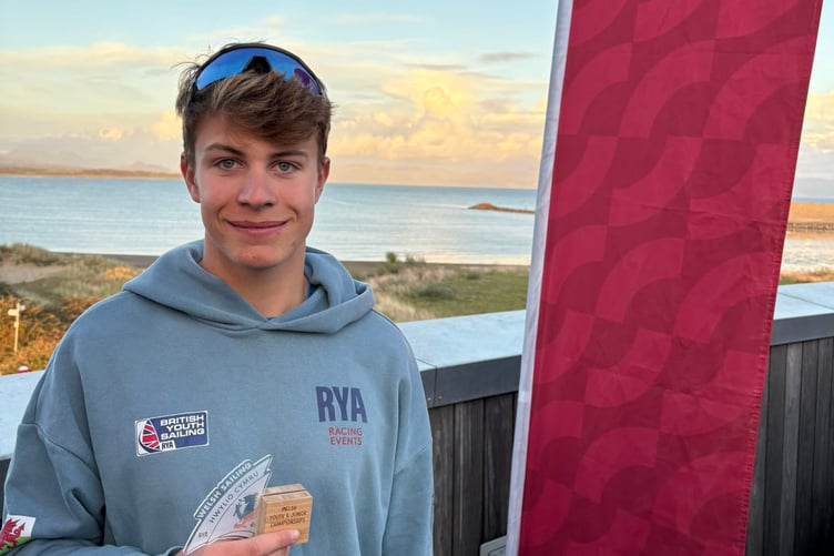 Steffan Williams with his trophy as Welsh Youth ILCA6 sailing champion