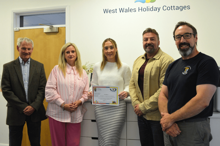 Winner of the Ceredigion Youth Bursary 2025 (Pictured, Left to Right: Councillor Wyn Thomas, Cabinet Member for Schools, Lifelong Learning and Skills; Lisa Stopher, Managing Director, West Wales Holiday Cottages; Ffion Marston, 2025 Bursary Winner; Councillor Clive Davies, Cabinet Member for Economy, Regeneration and Carbon Management and Gwion Bowen, Senior Children and Young People’s Participation Officer, Ceredigion County Council)
