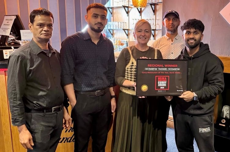 MP Liz Saville Roberts and some of the staff at Caernarfon Tandoori