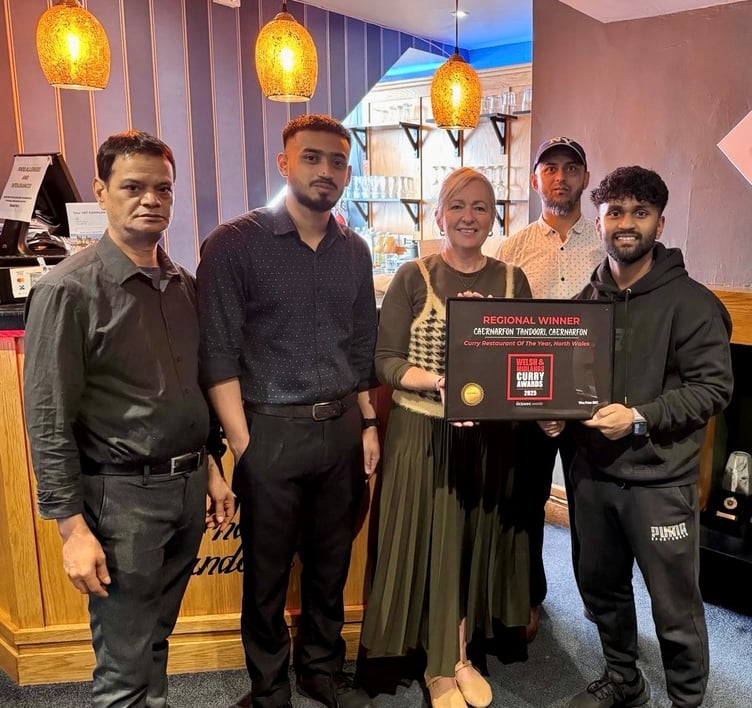 MP Liz Saville Roberts and some of the staff at Caernarfon Tandoori