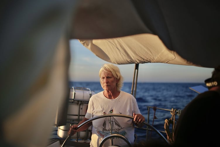 Hannah Schafer steering the Hio sailing boat as it heads for Gaza. Photo: Global Sumud Flotilla