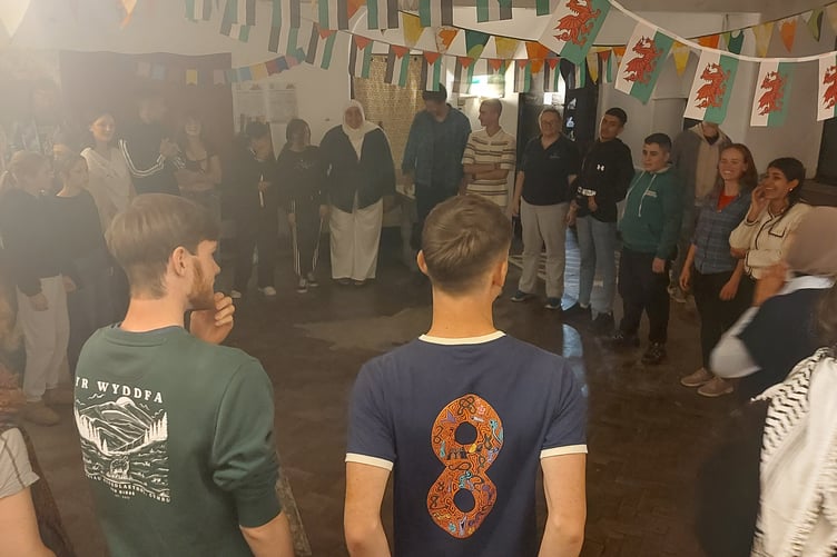 Exchanging the twmpath with renowned dance artist Angharad Harrop at the Owain Glyndwr Institute, with Dabke dancing taught by Palestinian youth group leader, Tamara. Photo: DVPS/ CADFA