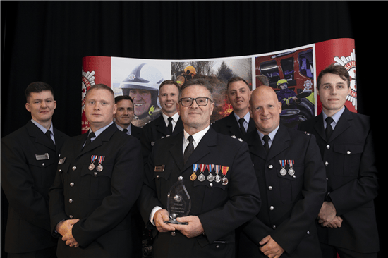 Barmouth Fire Station staff receive their award. Photo: North Wales Fire and Rescue Service