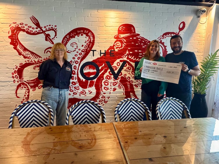 Restaurant owners Stag and Sophie present a cheque to RNLI Fundraising Chair, Sue McCann. Photo: RNLI/Emma Wood