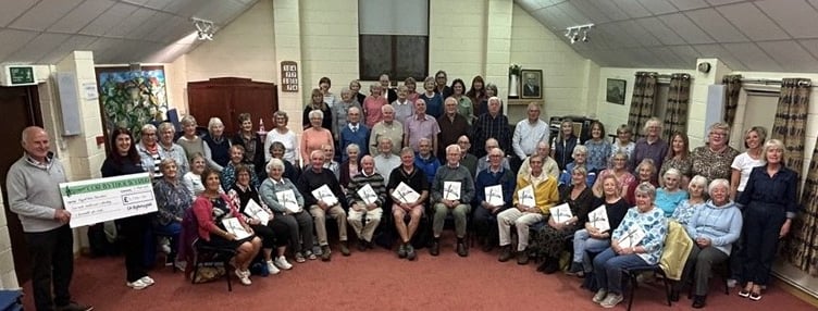 Pictured above: Côr Bytholwyrdd with Paige Denyer, Fundraising Support Officer for Hywel Dda Health Charities.