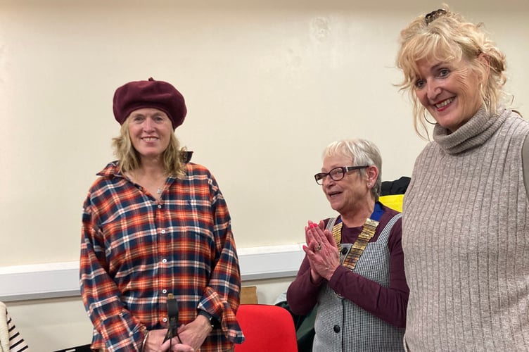 President Chrissie thanks speaker Lisa Markham and
her sister Catherine. Lisa is dressed as a Patagonian gaucho.