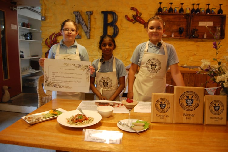 Madie, Serah and Liberty from Ysgol Gymunedol Gatholig Padarn Sant presenting their dishes. Photo: Cambrian News