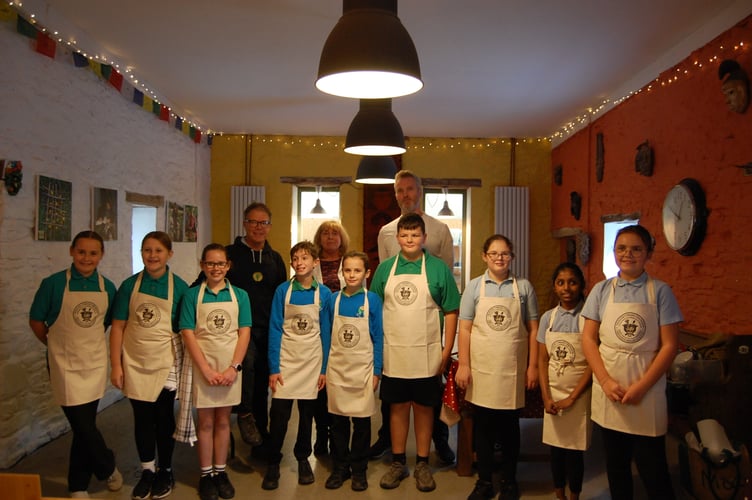 The budding chefs along with the three judges Gyles Morris, director of Naturesbase, Hazel Thomas, independent food consultant, and Douglas Balish, chef at the Grove. Photo: Cambrian News