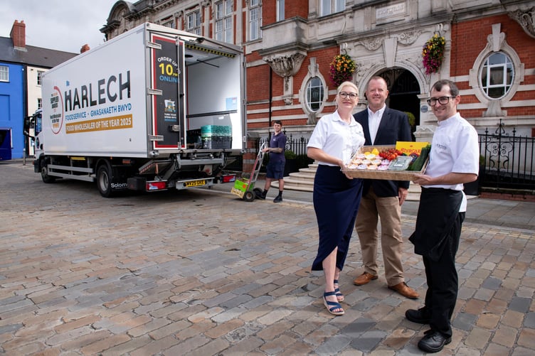 Morgans Hotel Head Chef Dylan Evans, right, takes a delivery from Nikki Morgan and Nick Sullivan, of Harlech Foodservice. Photo: Adrian White Photography.