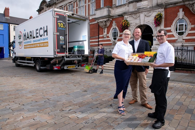 Morgans Hotel Head Chef Dylan Evans, right, takes a delivery from Nikki Morgan and Nick Sullivan, of Harlech Foodservice. Photo: Adrian White Photography.