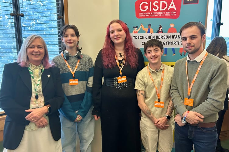 Liz Saville Roberts MP with Lewis, Keira, Zack, and Cefyn, young people from GISDA