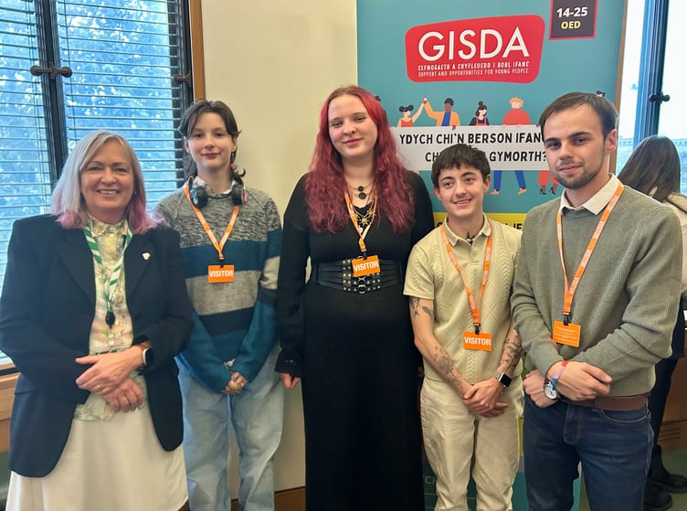 Liz Saville Roberts MP with Lewis, Keira, Zack, and Cefyn, young people from GISDA