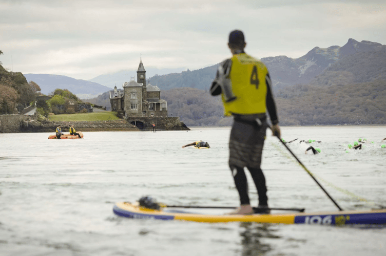 The tide was on their side as the swimmers passed the rail bridge. Photo: Dan Jones Images