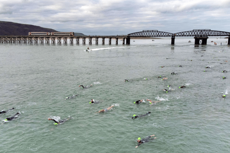 Photographer Dan Jones said he "underestimated the challenge of landing the drone on a moving boat", adding "a special mention to British Rail for kindly lining up a train to pass over the bridge just at that moment". Photo: Dan Jones Images