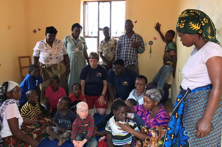 HAZINA staff and school children in Bangalala, Tanzania. Photo: HAZINA