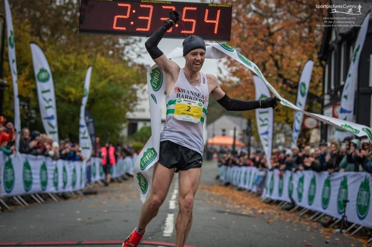 Mike Kallenberg  crosses the finishing line