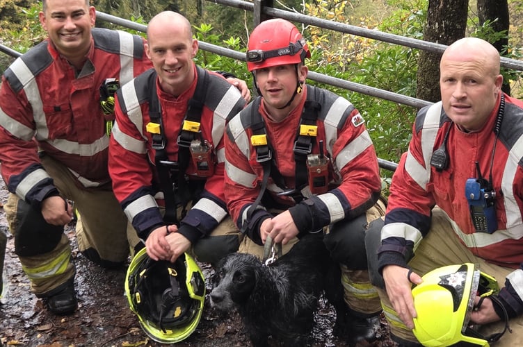 Pictured are members of the Aberystwyth crew at the scene alongside the rescued dog, marking a positive outcome to the incident. Photo: Mid & West Wales Fire & Rescue Service