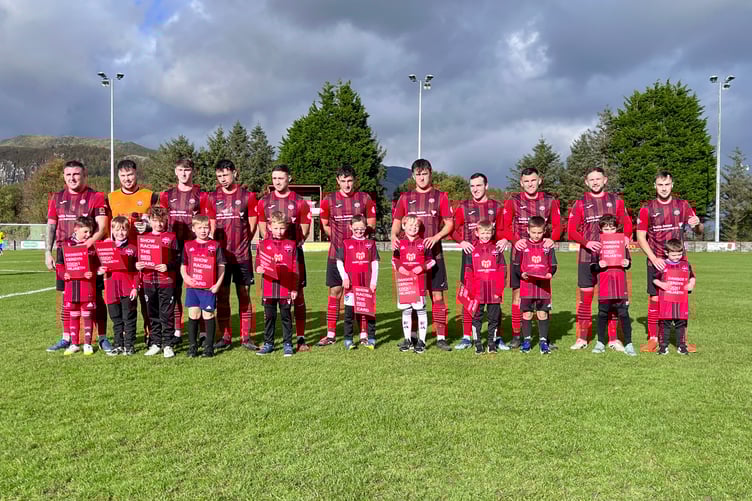 The Porthmadog team with the under 9s supporting the Show Racism the Red Card campaign